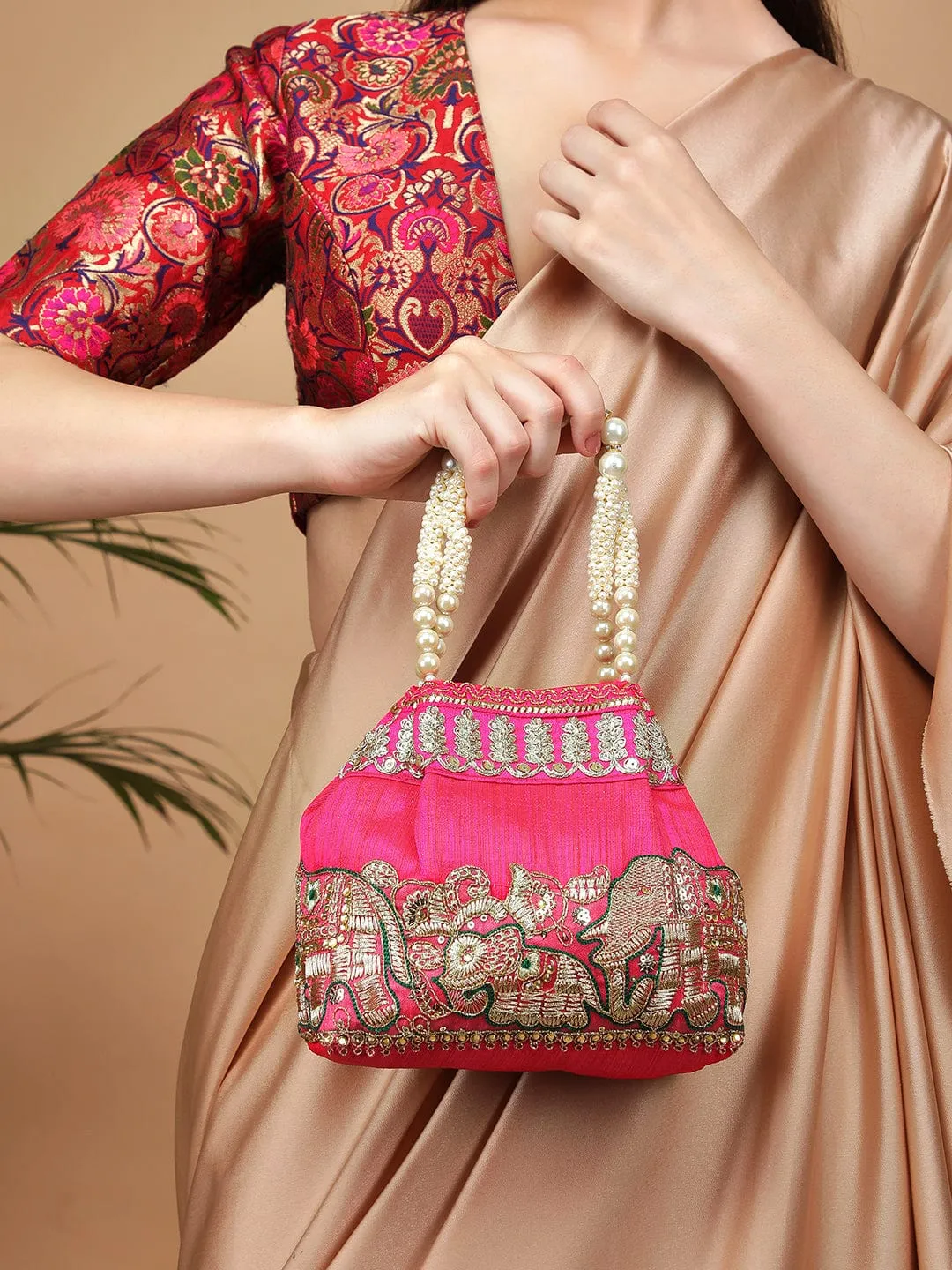 Elegant Pink Potli Bag with Luxurious Golden Embroidery Design